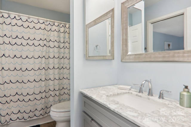 bathroom with vanity and toilet