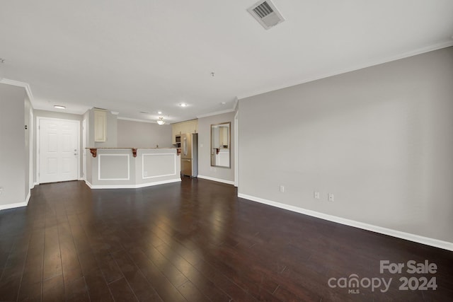 unfurnished living room featuring ornamental molding and dark wood-type flooring