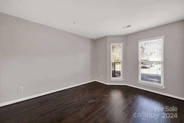 empty room with hardwood / wood-style floors