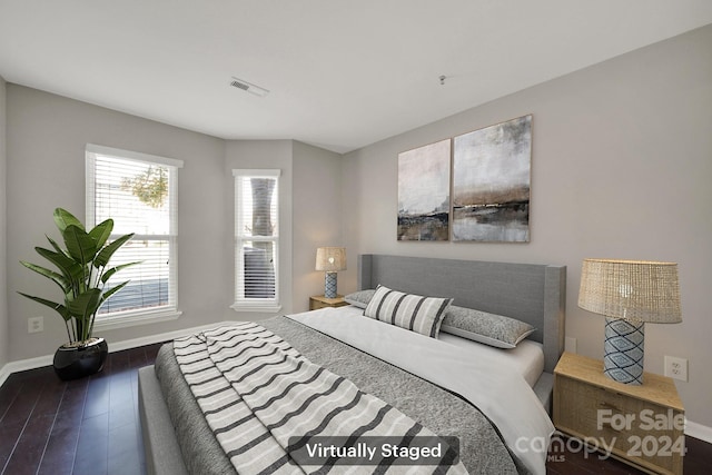 bedroom featuring dark hardwood / wood-style floors