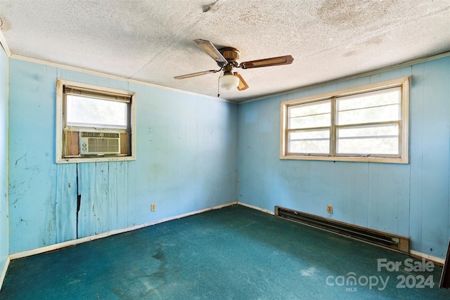 unfurnished room with a textured ceiling, a baseboard radiator, carpet flooring, and ceiling fan