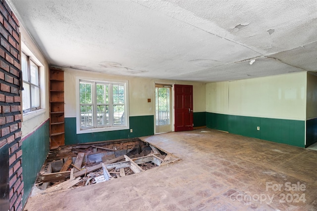 interior space featuring a textured ceiling