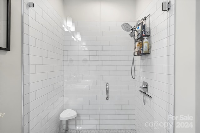 bathroom with a tile shower