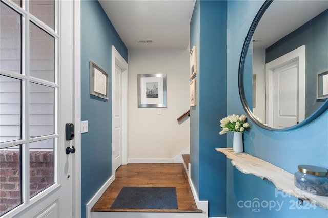 doorway to outside featuring dark hardwood / wood-style flooring