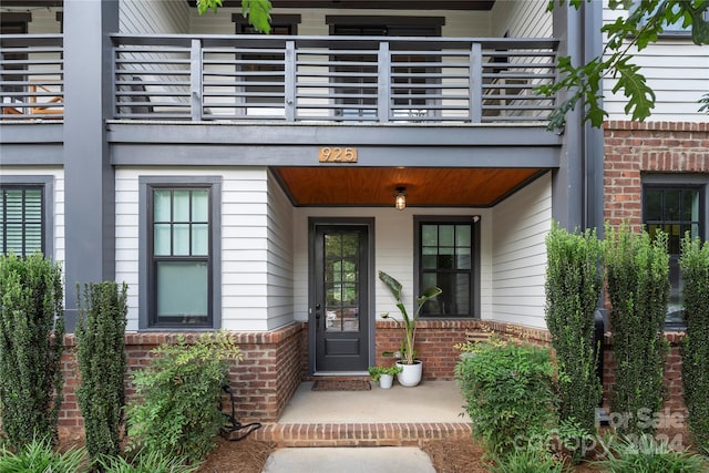 doorway to property featuring a balcony