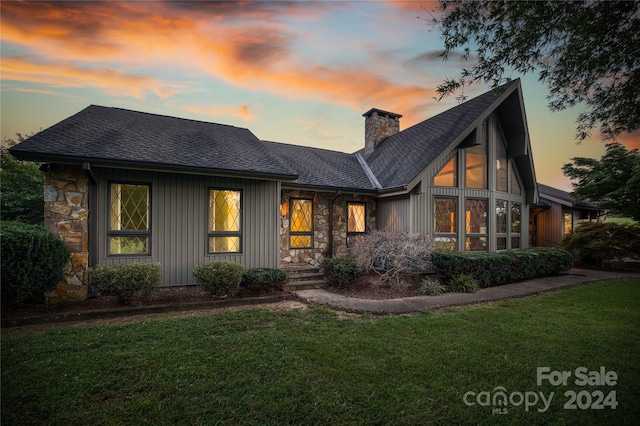 view of front of house with a yard