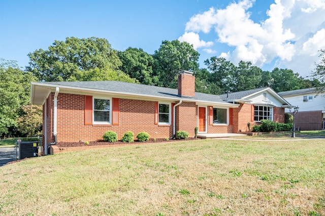 ranch-style house featuring a front yard and central AC