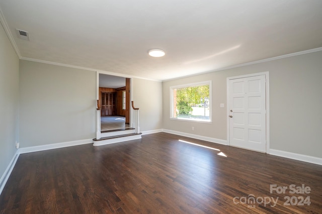 unfurnished living room featuring crown molding and dark wood-type flooring