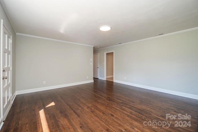 unfurnished room with dark hardwood / wood-style floors and crown molding