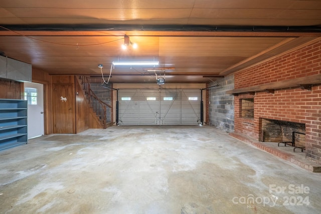 garage featuring wooden walls