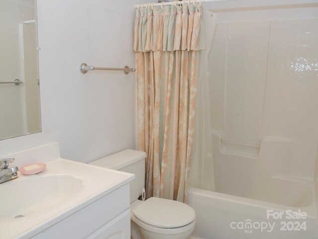 full bathroom with shower / bath combo, vanity, and toilet