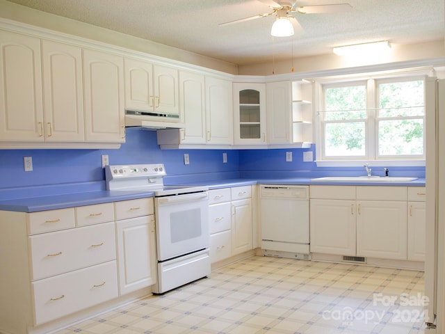 kitchen featuring white appliances, light tile patterned flooring, white cabinets, ceiling fan, and sink