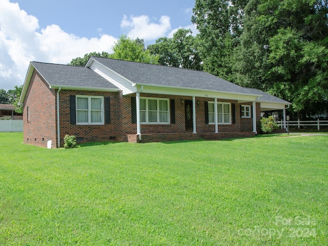 ranch-style house with a front lawn