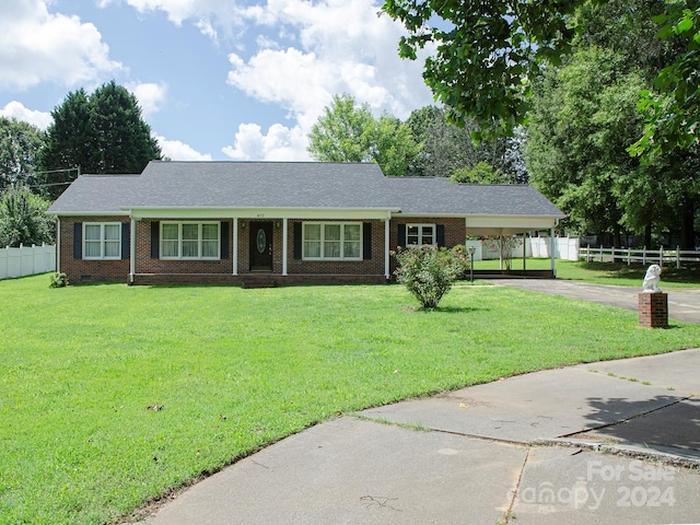 single story home featuring a front lawn