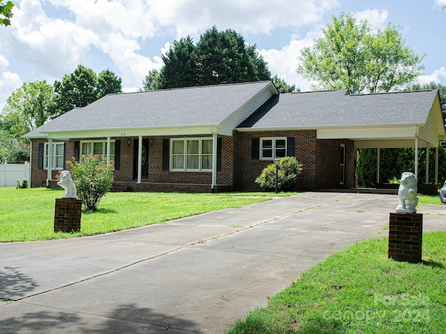 single story home with a carport and a front lawn