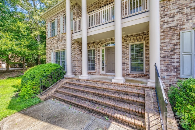 entrance to property with a balcony