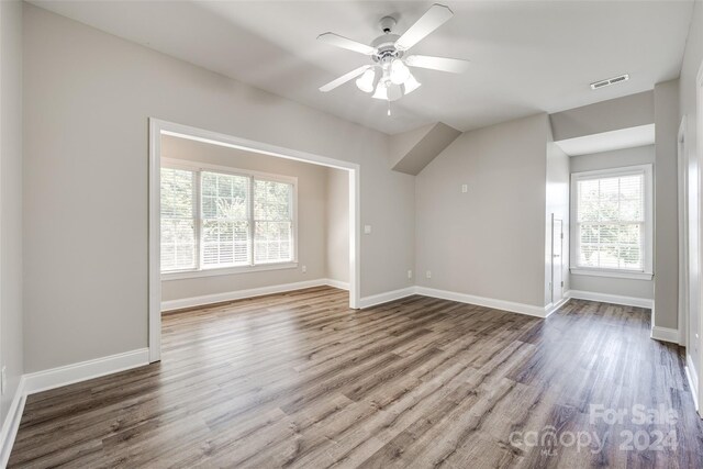 empty room featuring hardwood / wood-style floors and ceiling fan