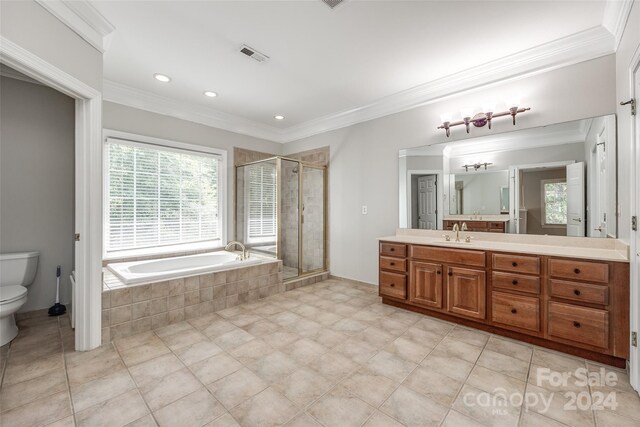 full bathroom with tile patterned floors, vanity, a wealth of natural light, and toilet