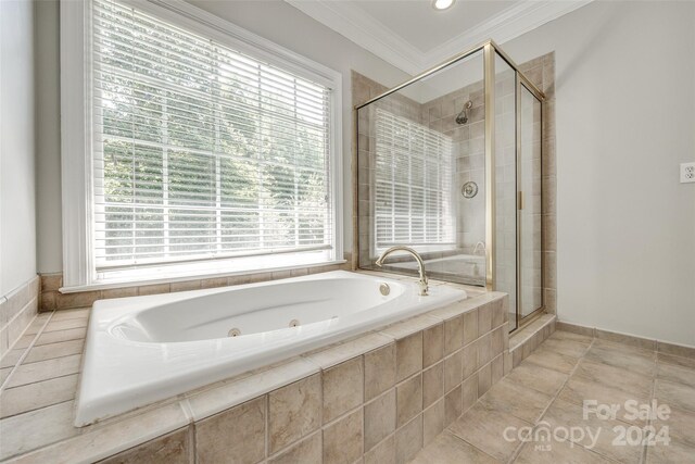 bathroom with ornamental molding, tile patterned flooring, and independent shower and bath