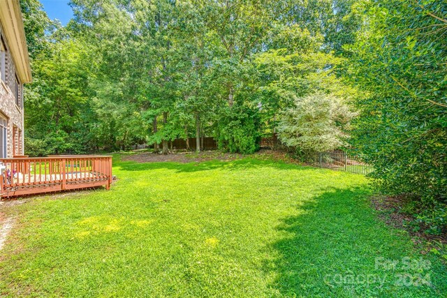 view of yard featuring a wooden deck