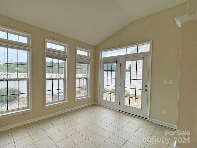 unfurnished sunroom with vaulted ceiling