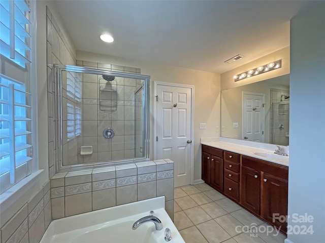 bathroom featuring vanity, separate shower and tub, and tile patterned flooring