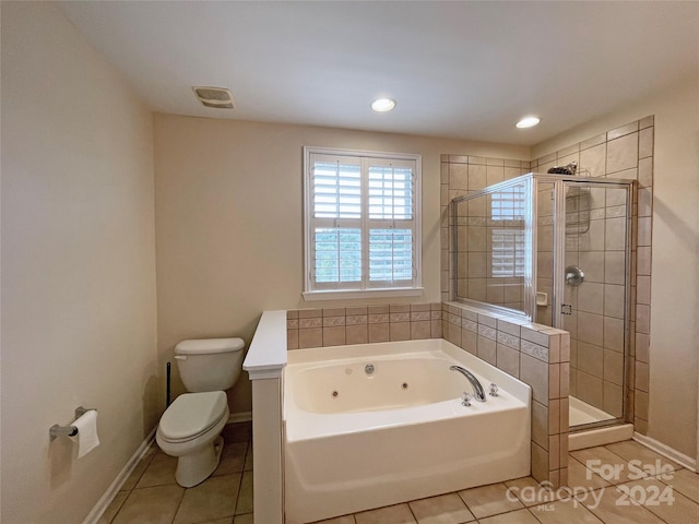 bathroom with toilet, plus walk in shower, and tile patterned flooring