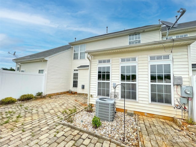 back of property featuring a patio and cooling unit