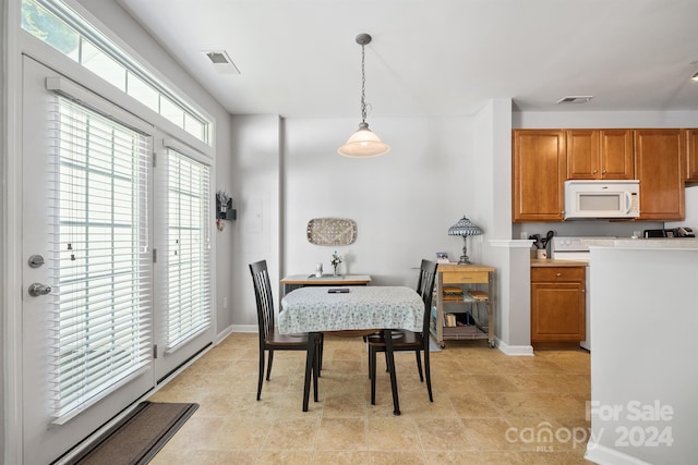 dining area with light tile patterned floors