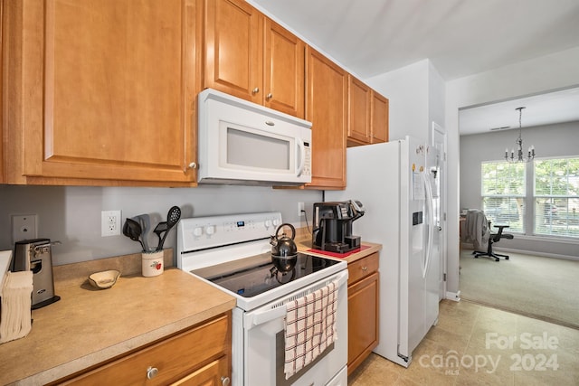 kitchen featuring light tile patterned flooring, a notable chandelier, hanging light fixtures, and white appliances