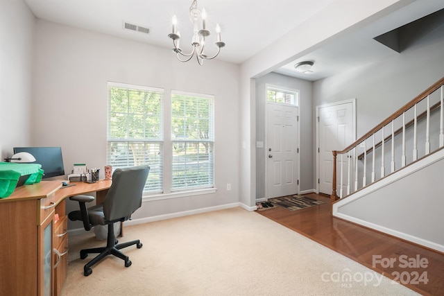 home office with an inviting chandelier and wood-type flooring