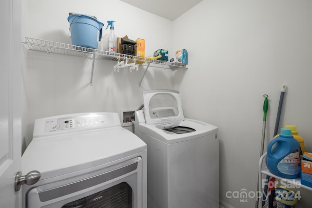 laundry room featuring washing machine and dryer