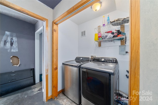 laundry area with independent washer and dryer