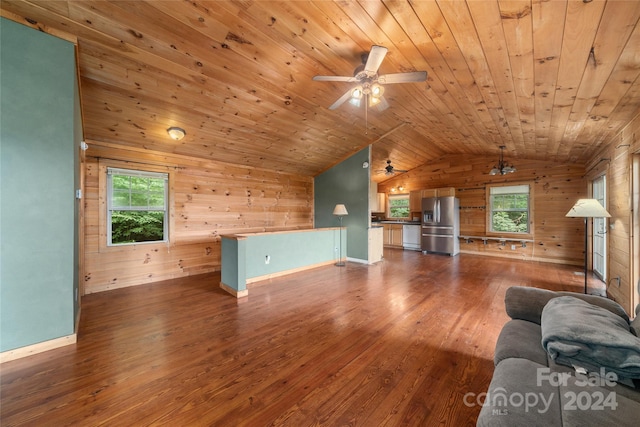 unfurnished living room featuring ceiling fan, a wealth of natural light, wood-type flooring, and wooden ceiling