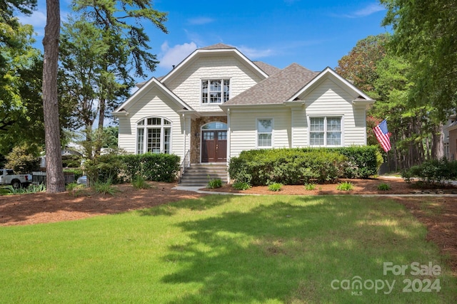 view of front of property with a front lawn