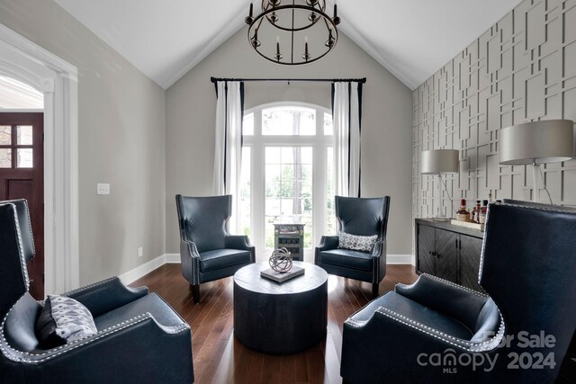 interior space featuring dark wood-type flooring and vaulted ceiling