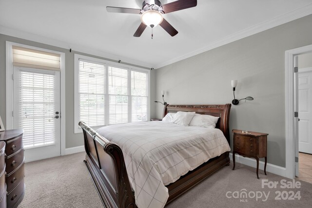 bedroom with crown molding, light colored carpet, baseboards, access to exterior, and ceiling fan