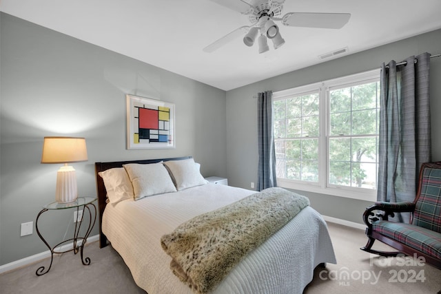 bedroom with ceiling fan and light colored carpet