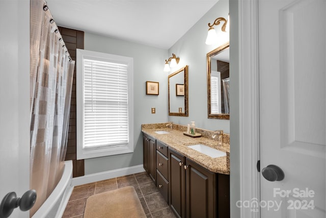 bathroom featuring shower / bathtub combination with curtain, tile patterned flooring, a healthy amount of sunlight, and vanity