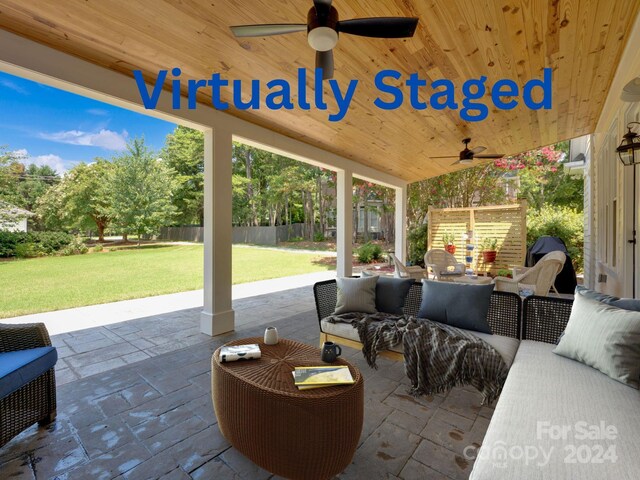 view of patio / terrace with a ceiling fan, fence, and outdoor lounge area