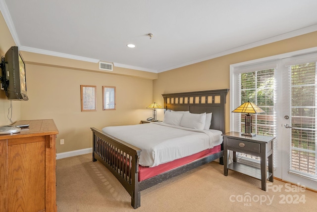 bedroom with visible vents, crown molding, baseboards, light colored carpet, and access to exterior