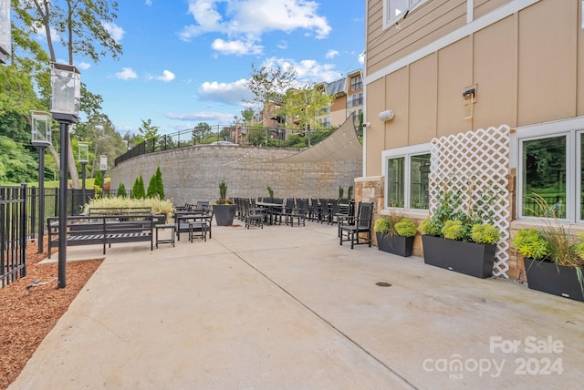 view of patio / terrace featuring fence