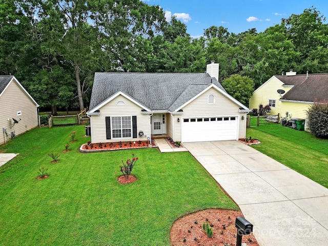 view of front of home with a garage and a front yard