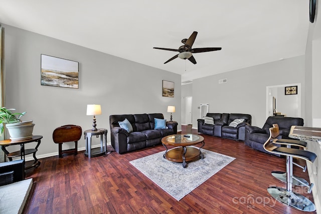 living room with dark hardwood / wood-style floors and ceiling fan