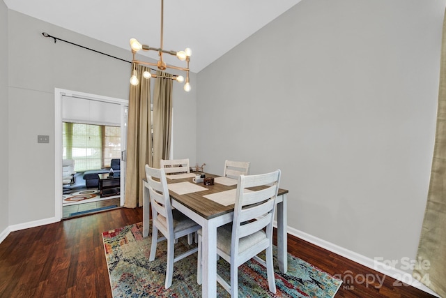 dining area featuring a notable chandelier, dark hardwood / wood-style flooring, and high vaulted ceiling