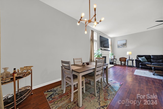 dining space featuring a chandelier and dark wood-type flooring