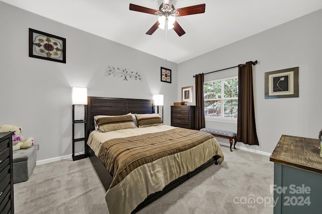 bedroom featuring light colored carpet and ceiling fan