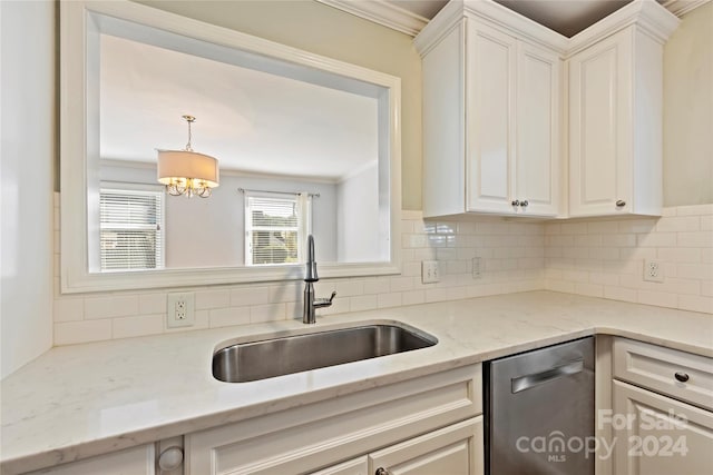 kitchen with sink, light stone counters, backsplash, stainless steel dishwasher, and crown molding