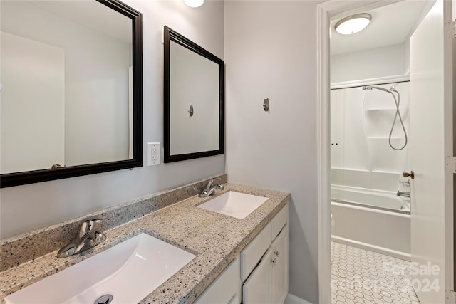 bathroom with shower / bath combination, tile patterned flooring, and dual bowl vanity