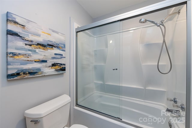 full bath featuring combined bath / shower with glass door and toilet